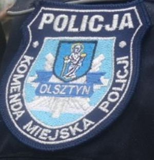 Zdjęcie przedstawia naszywkę Komendy Miejskiej Policji w Olsztynie.