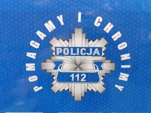 Napis "Pomagamy i Chronimy".