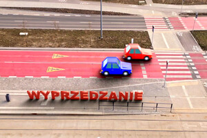 Grafika przedstawiająca samochody przed przejściem dla pieszych