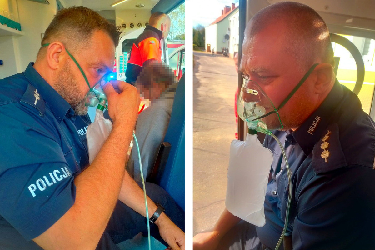 asp. Artur Gudaniec i asp. szt. Mariusz Brończyk siedzący w karetce z maskami tlenowymi na twarzach