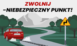 Samochód wypadający z drogi na zakręcie i napis Zwolnij - Niebezpieczny punkt!"